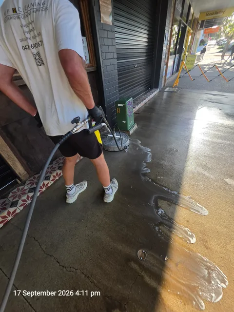 UP 2 Cleaning operator cleaning the concrete footpath at The Bread Social in Tweed Heads