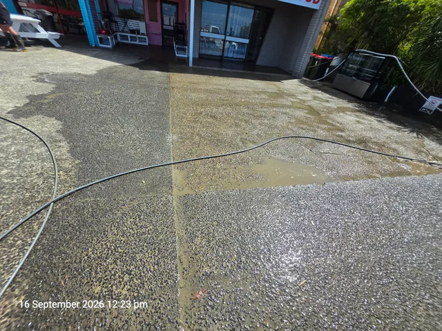 During-cleaning comparison at Uncle George’s Coffee Shop: dirty concrete on the left and cleaned concrete on the right