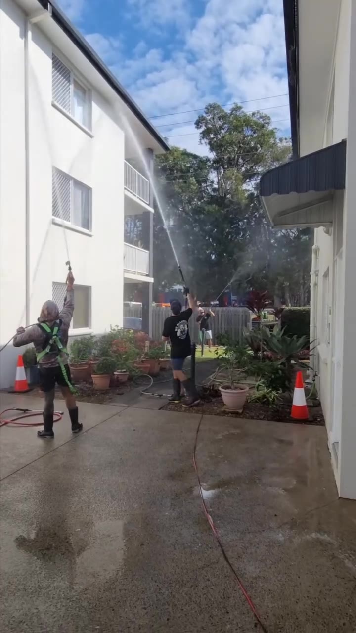 Up 2 Cleaning crew washing a body corporate building exterior in Tweed